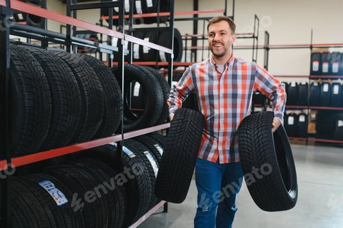 Preview: Man chooses winter car tires in the auto shop