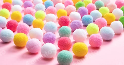 Preview: Colorful soft pom pom balls on pink background