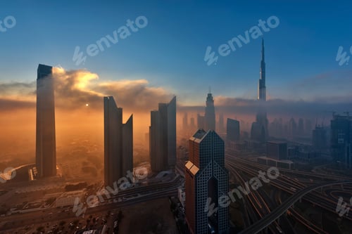 Preview: Citiscape with skyscrapers in Dubai, United Arab Emirates at dusk.