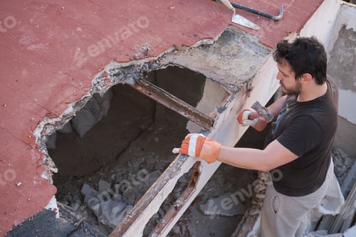 Preview: Young man pulling apart the ceiling of a house down.