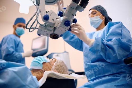 Preview: Mature woman having eye surgery at ophthalmology clinic.