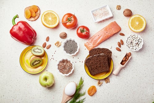 Preview: Healthy FODMAP diet food in heart shape. Organic fruits, vegetables, greenery, nuts, beans,