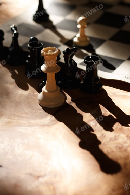 Preview: Closeup shot of the chess figures next to the board