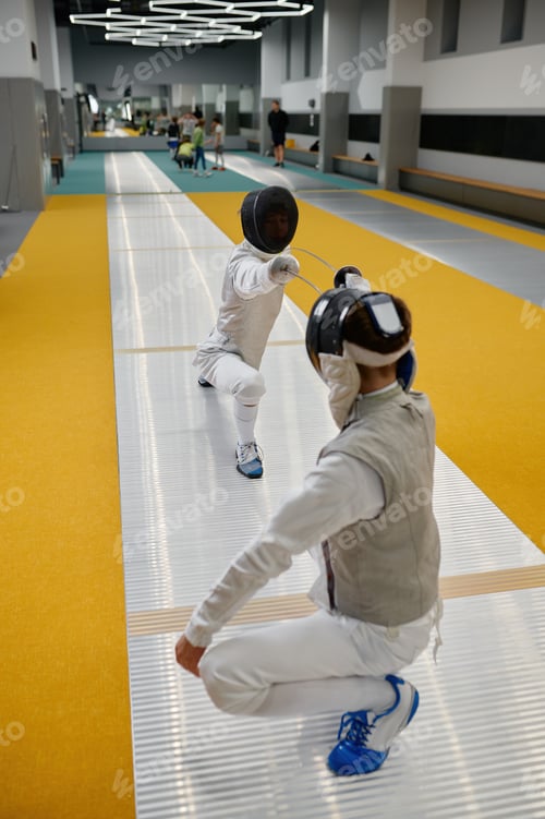 Preview: Duel of fencers during fencing match, training lesson at martial art class