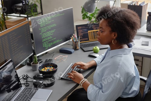 Preview: Software Developer Typing on Keyboard in Office