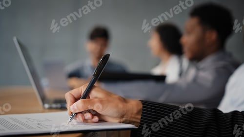Preview: Close-up female hand writing notes on paper signing document contract unrecognizable businesswoman