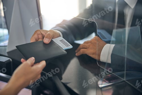 Preview: Male in suit checking in before flight