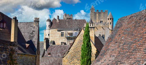 Preview: Aerial view of a cityscape: Eleventh-century Beynac Castle Jutting out above rooftops, France