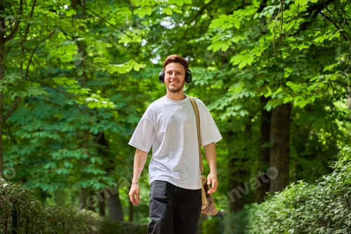 Preview: A portrait of a man walking through a park,