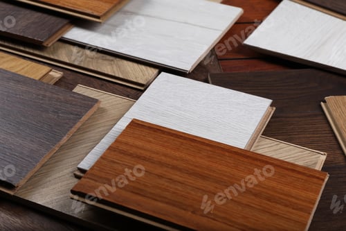 Preview: Many different samples of wooden flooring on table