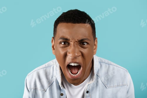 Preview: Aggressive angry sad millennial black man freaking out, screaming, suffering from work problems