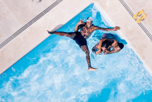 Preview: African friends play in the pool happy.