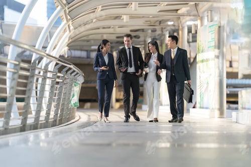 Preview: Business people walking and talk to each other in front of modern office