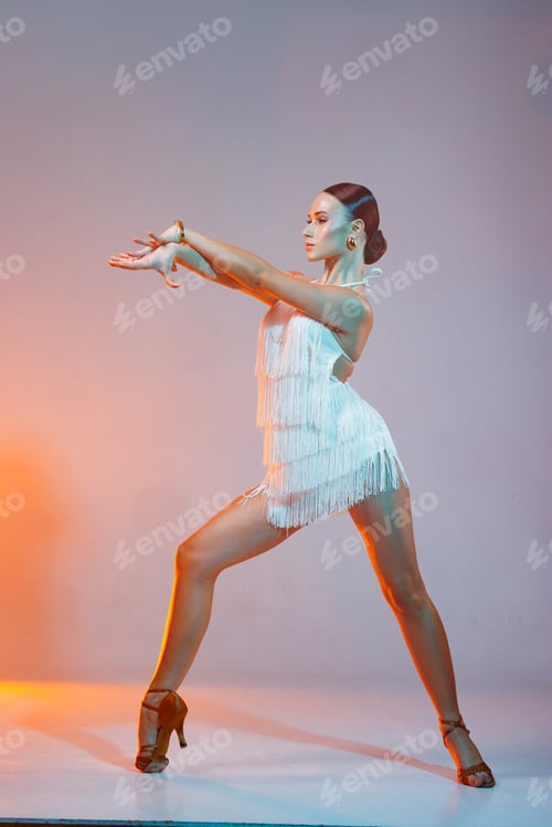 Preview: Latin Female Dancer in White Fringe Dress Posing in Studio Samba Salsa Latin American Dance