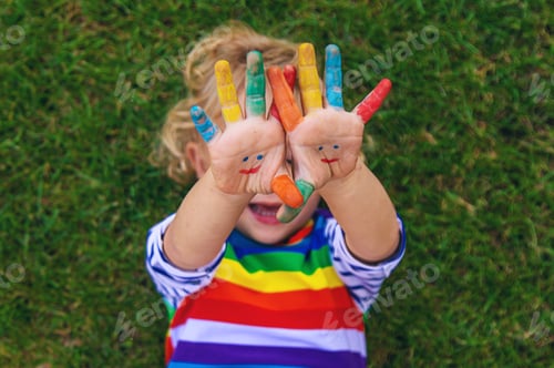 Preview: Child in hand draw smile. Selective focus.