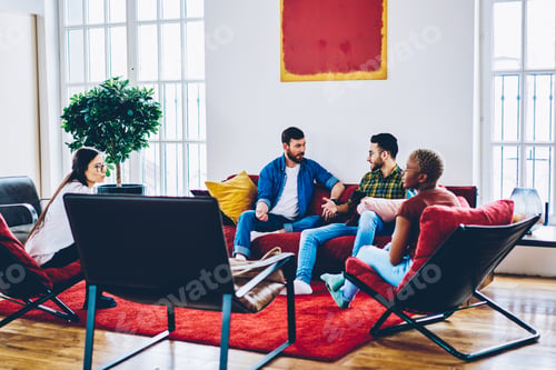 Preview: Teen multiracial hipsters spending leisure time for talking during guests meeting