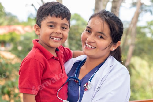 Preview: Portrait of a happy child being held by his pediatrician. Portrait of a smiling doctor and child.