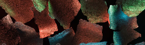 Preview: panoramic shot of abstract background of torn foil with colorful illumination isolated on black