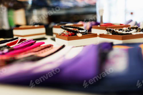 Preview: Neckties and bracelets displayed in showroom