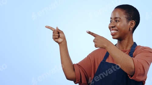Preview: Woman, smile and pointing for presentation in studio with hands, announcement or advertising space.