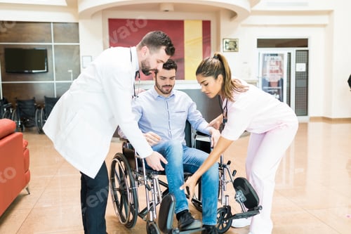 Preview: Healthcare Workers Taking Care Of Recovered Patient At Hospital