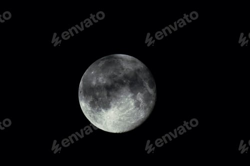 Preview: Low angle shot of the magnificent full moon in the black night sky