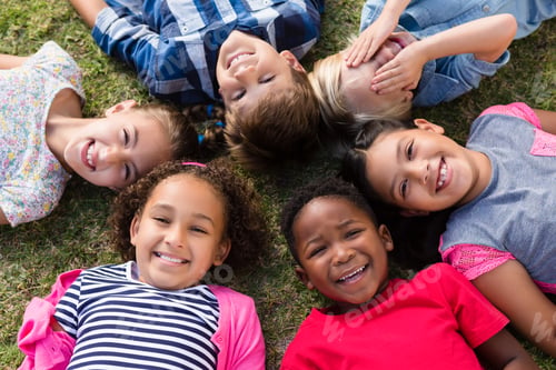 Preview: Directly above portrait of children lying on field