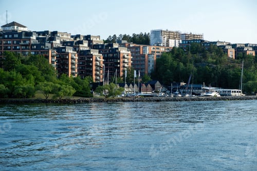 Preview: Nacka Strand marina at Stockholm County Archipelago Sweden. Building at seaside, moored yacht in sea