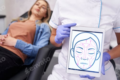 Preview: Doctor presenting digital tablet with face lifting sketch