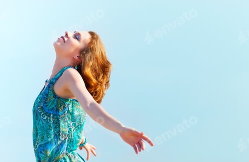 Preview: Portrait of the beautiful young woman with fluttering red hair