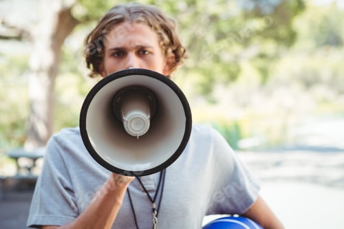 Preview: Portrait of male coach using megaphone