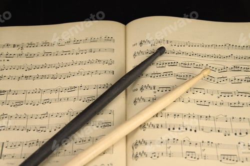 Preview: Drum sticks on the music sheet