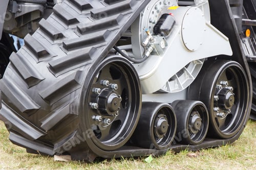 Preview: Detail and part of metal wheel with caterpillar. Transportation