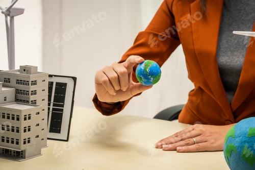 Preview: A businesswoman working at a desk in sustainable urban development, promoting eco-friendly