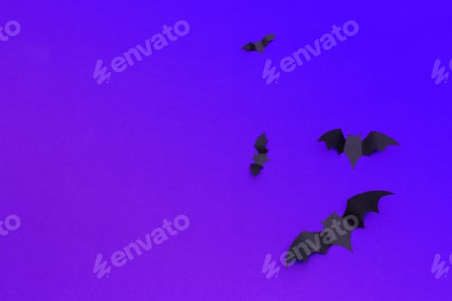 Preview: halloween and decoration concept - paper bats flying