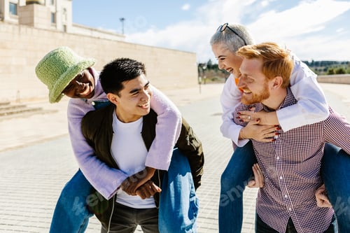 Preview: Multi ethnic group of happy young people having fun together