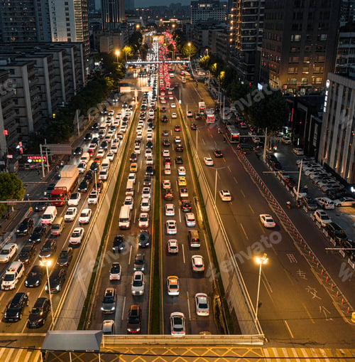 Preview: Intersection during the evening rush hour is filled with vehicles