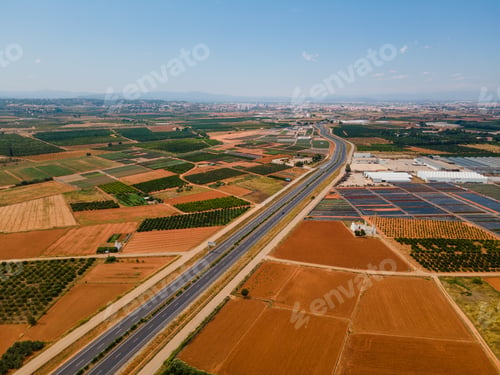 Preview: Aerial view of the road passing between fields. Valencia, Spain.
