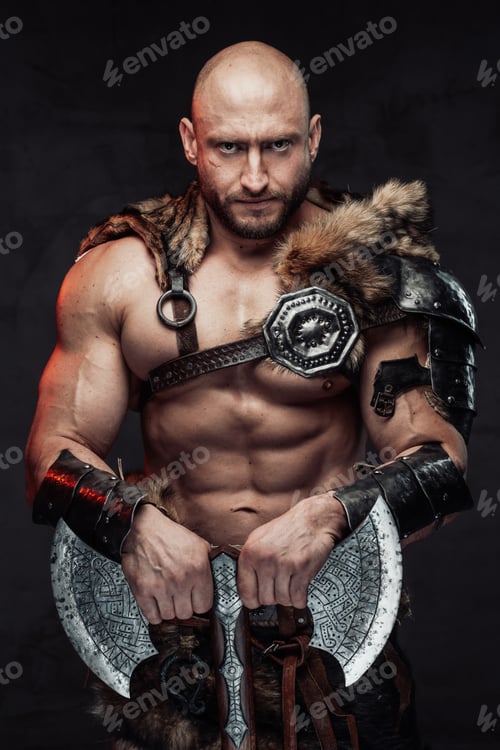 Preview: Serious bald viking posing in dark background with double axe