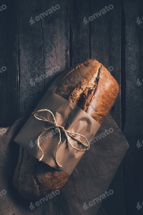 Preview: Rustic bread loaf on dark background