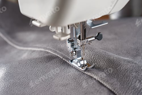 Preview: Modern Sewing Machine With Gray Velours Fabric Close Up