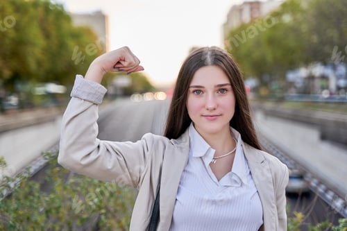 Preview: Young hispanic girl wearing business clothes showing arms muscles smiling proud. fitness concept.