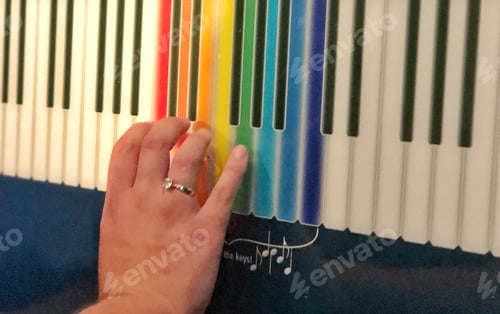 Preview: Music and Science Child plays a keyboard learning about sound and the electromagnetic spectrum