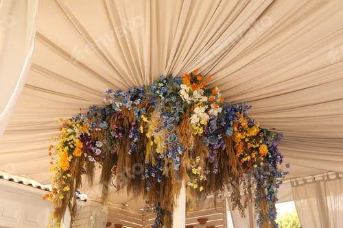 Preview: Different flowers as decor of restaurant in sunny day