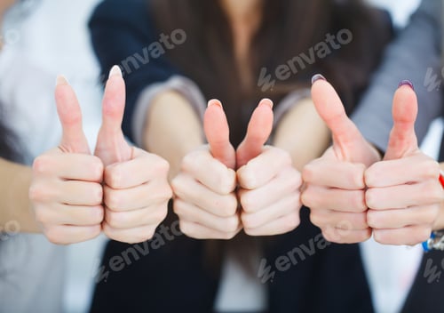 Preview: business team showing thumbs up in office
