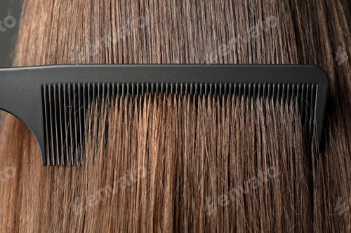 Preview: Brushing hair with plastic comb, closeup view