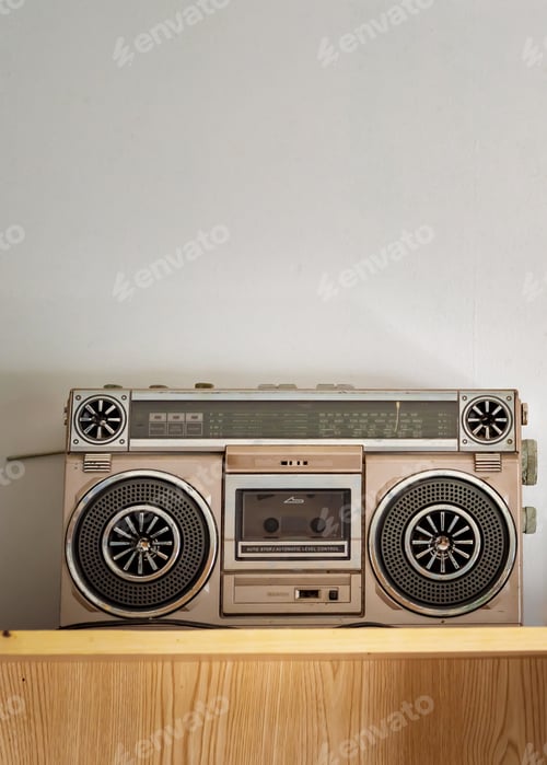 Preview: Retro outdated portable stereo boombox radio cassette recorder from 80s on the shelf.