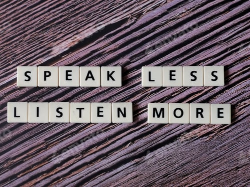 Preview: Speak less listen more word made from square letter tiles on wooden background.