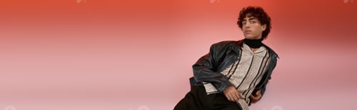 Preview: Stylish young man showcasing modern fashion against a vibrant gradient background