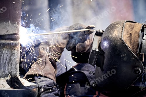 Preview: Construction Worker Arc Welding The Metal Pipe.